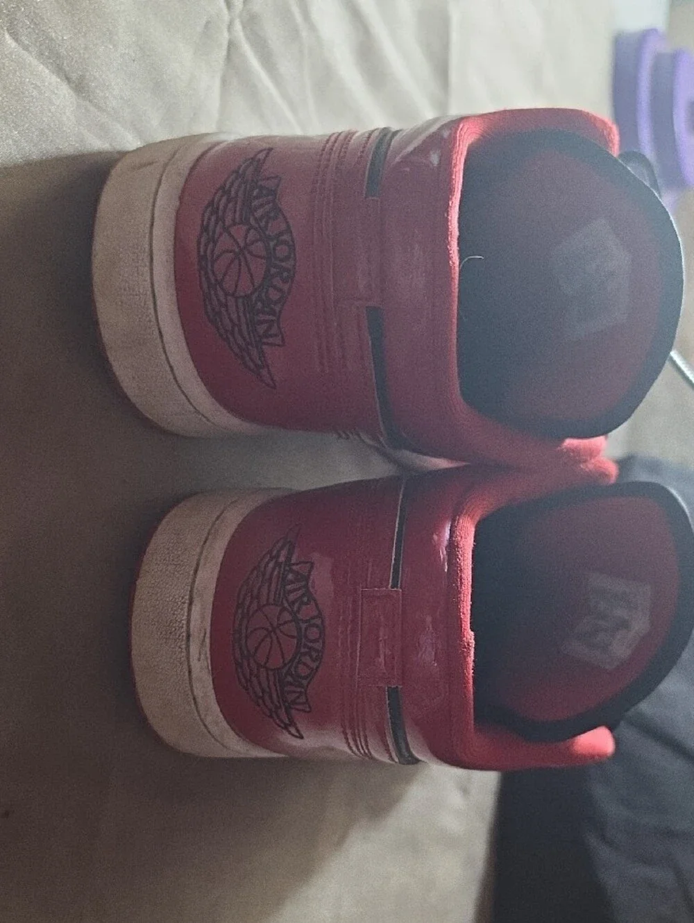 Jordan Red and Black High-Top Sneaker Tongue Label Detail